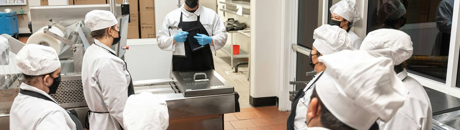 Georgia food service workers receiving food handler training in a commercial kitchen