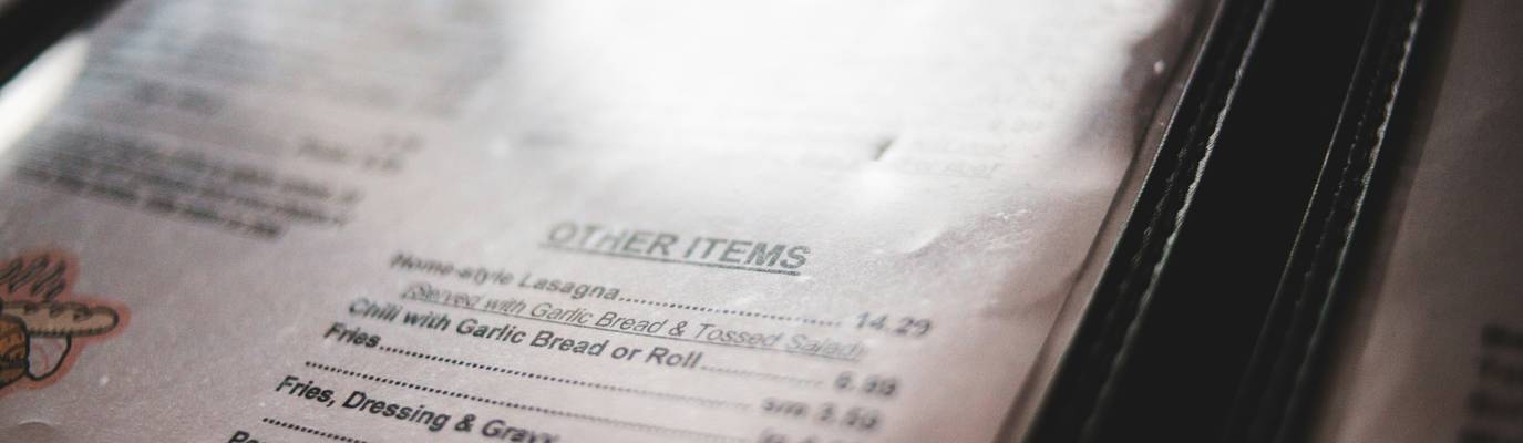Georgia restaurant manager reviews a compliance checklist with a county health inspector