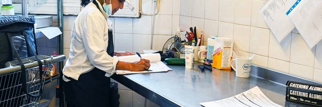 Georgia health inspector checks food temperatures in a commercial kitchen