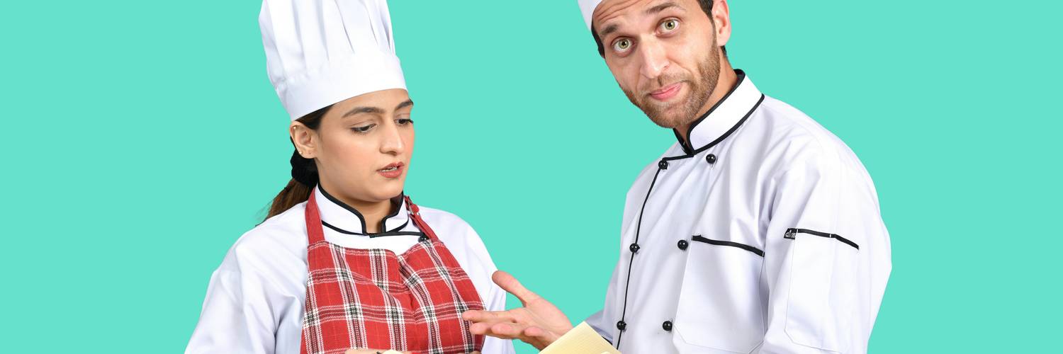 Georgia kitchen manager reviews a written food-safety policy with staff