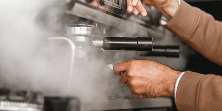 Georgia restaurant manager reviews a binder of temperature and sanitizer logs before a health inspection